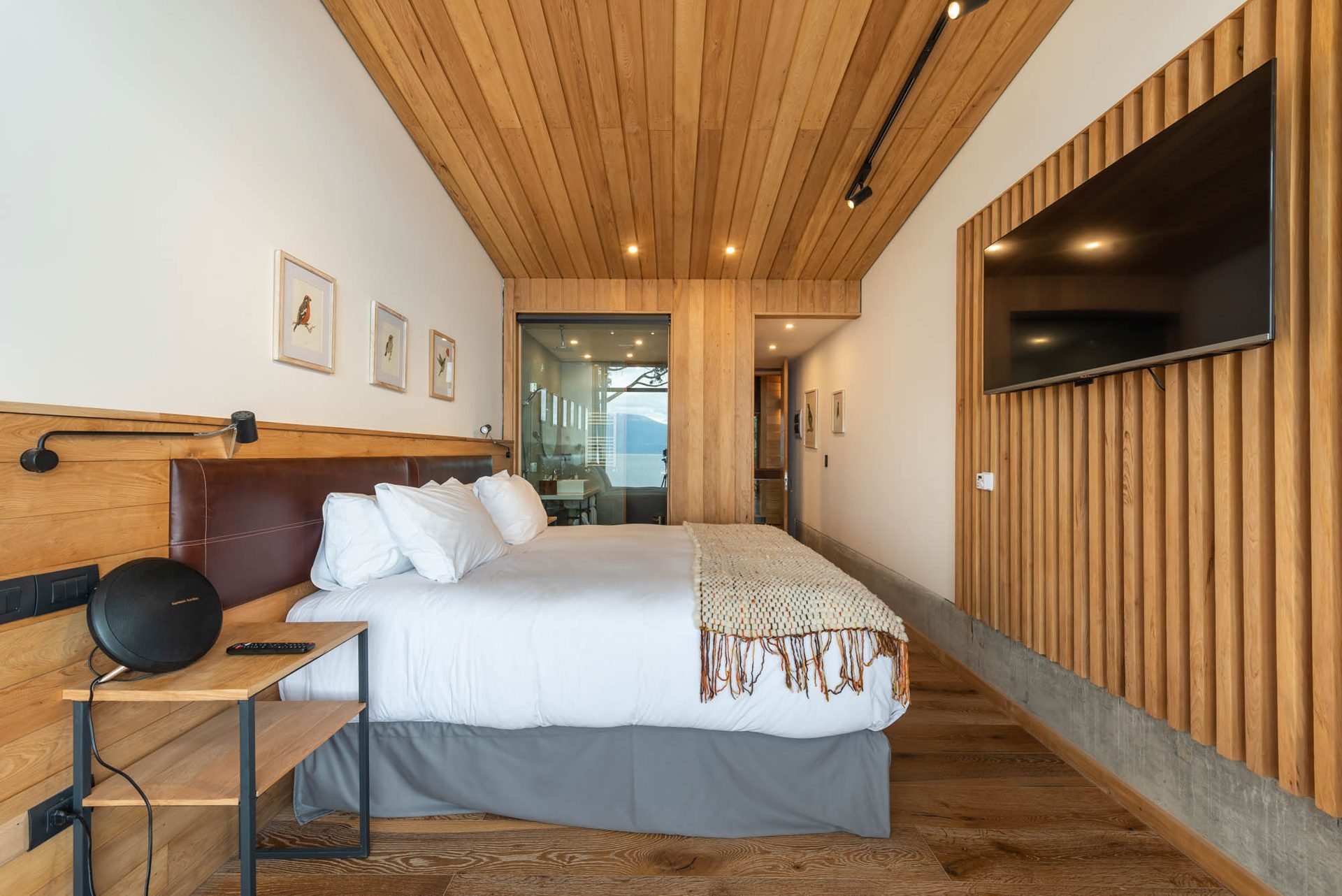 A room at Hotel AWA opening to Lake Llanquihue and the forest